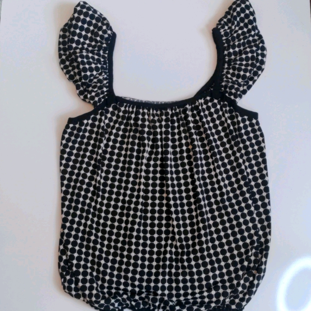 Black and white sleeveless ruffle top
